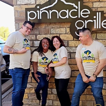 Group photo in front of Pinnacle Grille representing the Pay It Forward event.