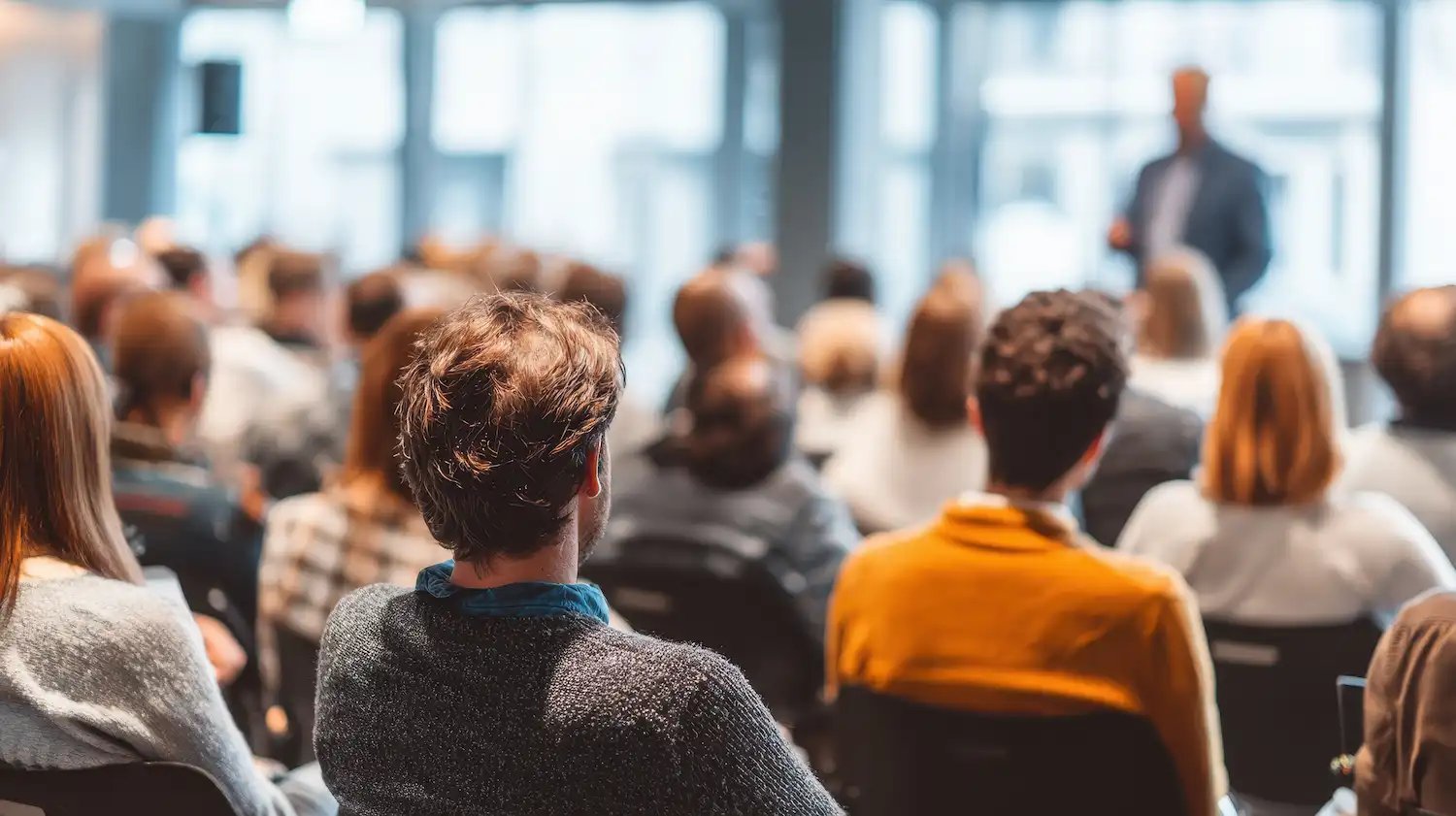 workshop-in-action-with-speaker-in-front-of-audience workshop-in-action-with-speaker-in-front-of-audience